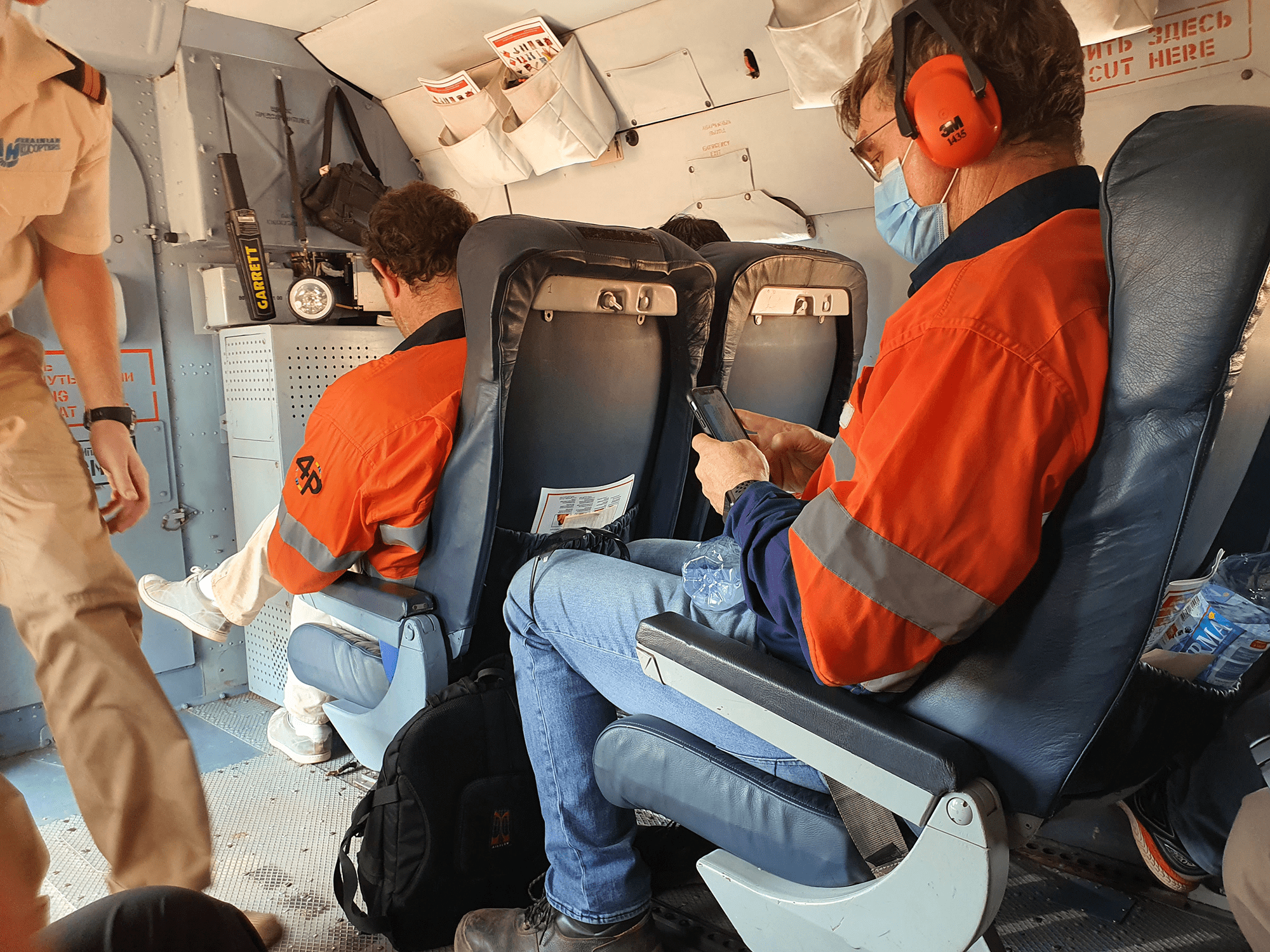 Middle East Freighters. Panafrican Air Services. Passenger. People sitting inside the airplane.